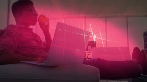 Man Enjoying Coffee with Laptop in Pink Digital Interface