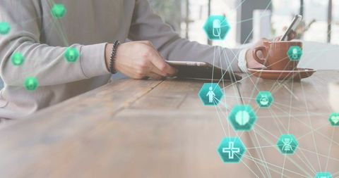 Businessman Using Tablet at Cafe with Digital Health Interface