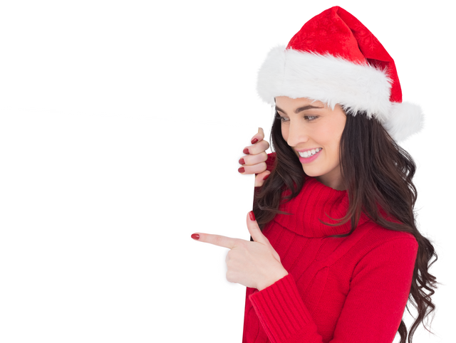 Brunette Woman in Santa Hat Pointing at White Transparent Poster - Download Free Stock Videos Pikwizard.com