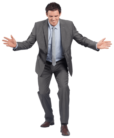 Confident businessman in gray suit standing with arms spread