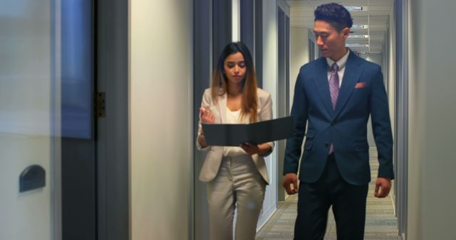 Business Professionals Walking in Office Corridor Discussing Work - Download Free Stock Images Pikwizard.com