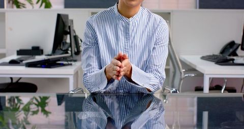 Business professional using sign language during office meeting