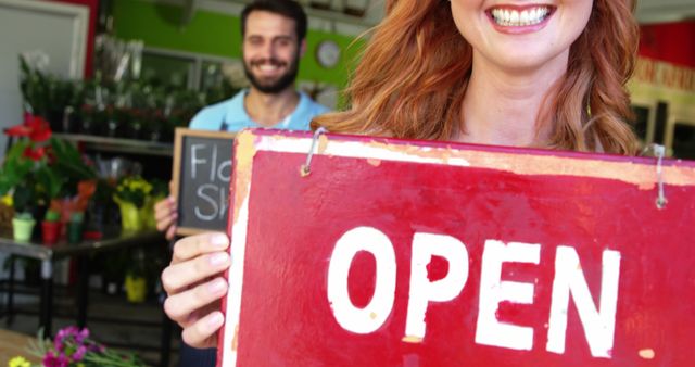 Small Business Owners Holding Open Sign at Flower Shop - Download Free Stock Images Pikwizard.com