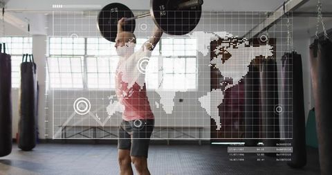 Male athlete performing overhead barbell lift in gym with digital hud world map overlay