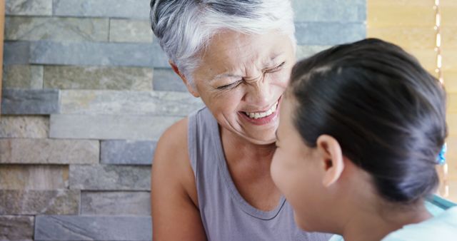 Smiling Elderly Woman Bonding with Young Girl at Home - Download Free Stock Images Pikwizard.com