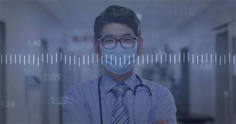 Healthcare Professional Analyzing Data in Hospital Corridor