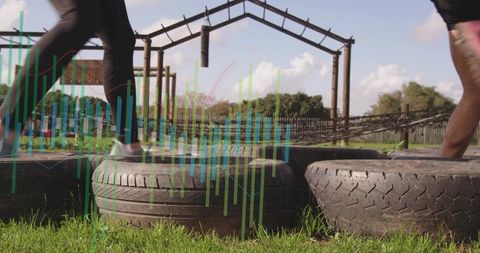 Outdoor Fitness: Navigating Tire Obstacle Workout in Park