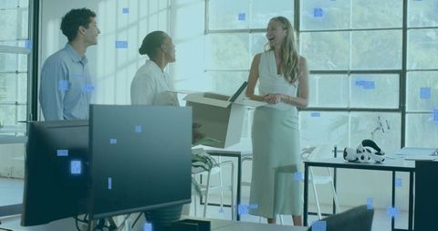Smiling woman leading team conversation in open-plan office with vr headset and daylight