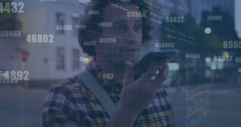 Finance technology: man using smartphone with data overlay