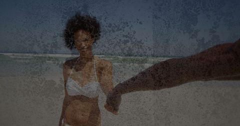 Joyful Woman in Bikini Holding Partner Hand on Sunny Beach
