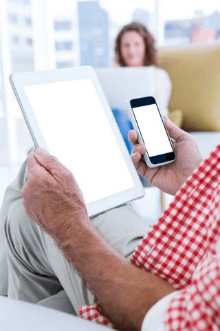 Transparent screens on tablet and smartphone in modern workplace