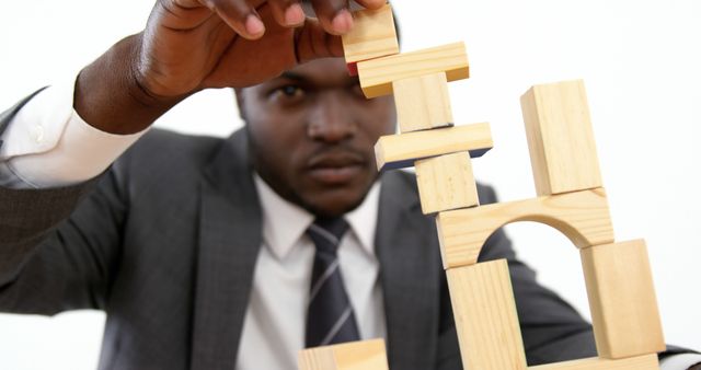 Focused Professional Stacking Wooden Blocks - Download Free Stock Images Pikwizard.com