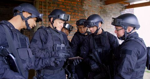 Tactical Team in Discussion Planning Strategy - Download Free Stock Images Pikwizard.com