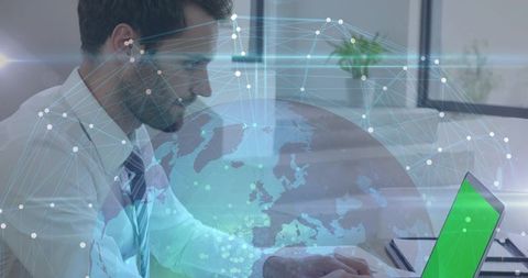 Businessman typing laptop with holographic globe and network overlay for connectivity