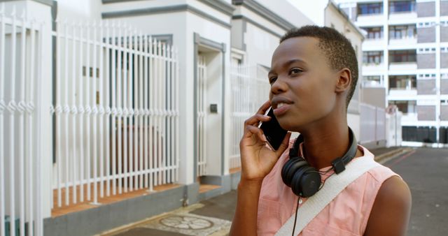 Young Woman Talking on Mobile Phone Wearing Casual Clothes City Street - Download Free Stock Images Pikwizard.com