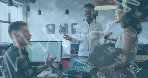 Diverse Team Collaborating on Financial Analysis in Modern Office