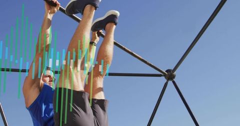 Performing hanging leg raises on geodesic frame outdoors targeting core strength