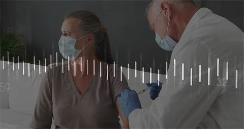 Doctor vaccinating senior woman in clinic setting