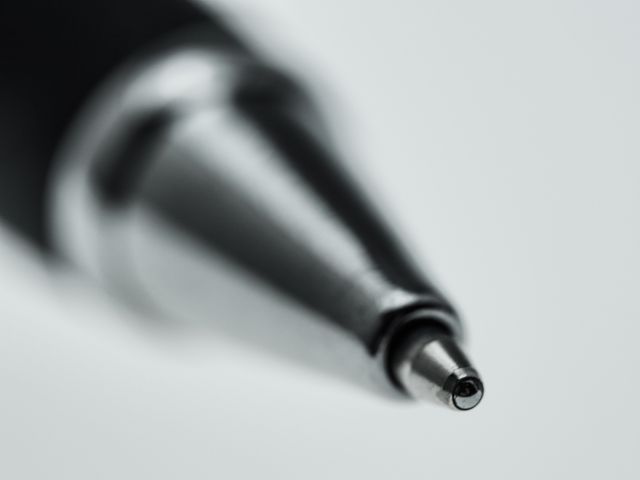 Elegant close-up of a mechanical pencil tip, perfect for illustrating concepts of precision, writing processes, and design. Great for educational materials, office-related content, and promotional materials for stationery products.