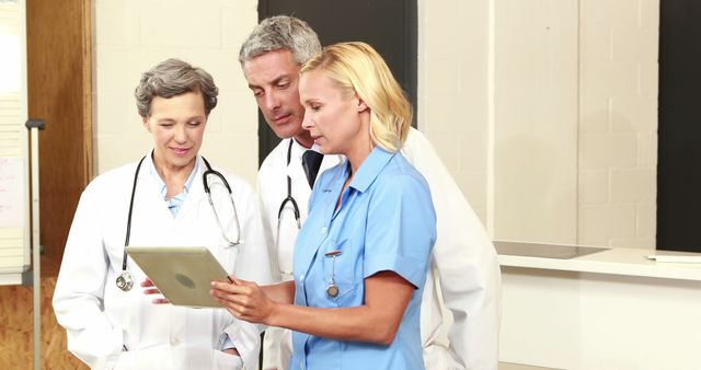 Medical Team Collaborating Using Digital Tablet - Download Free Stock Images Pikwizard.com