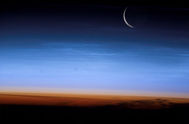 Crescent Moon Over Earth's Stratosphere Captured from ISS - Download Free Stock Photos Pikwizard.com
