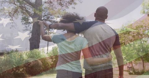 African American Couple Walking with American Flag Overlay