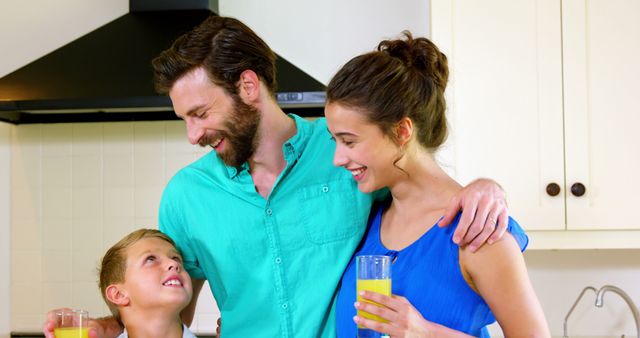 Happy Family Enjoying Fresh Juice in Kitchen - Download Free Stock Images Pikwizard.com