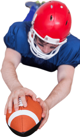 Determined athlete holding football showing transparent determination
