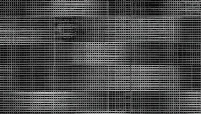 Contemporary metal grate facade with geometric pattern in industrial design