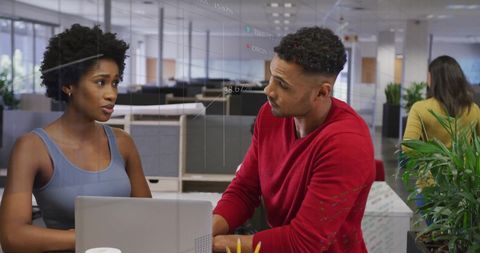 Colleagues Discussing Work with Digital Data Overlays