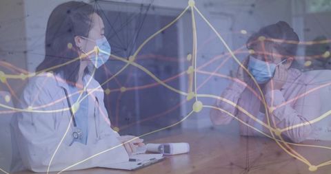 Medical consultation: doctor examining patient with advanced technology overlay