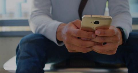 Business Professional Holding Smartphone for Communication