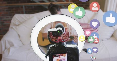 female vlogger creating content at home with guitar - Download Free Stock Images Pikwizard.com