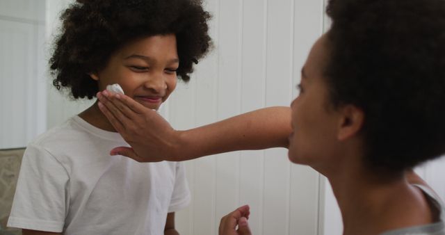 Mother Wiping Son’s Face with Towel in Bathroom - Download Free Stock Images Pikwizard.com
