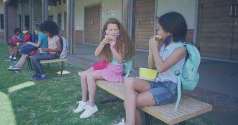 Schoolchildren Eating Lunch with Background of Mathematical Equations