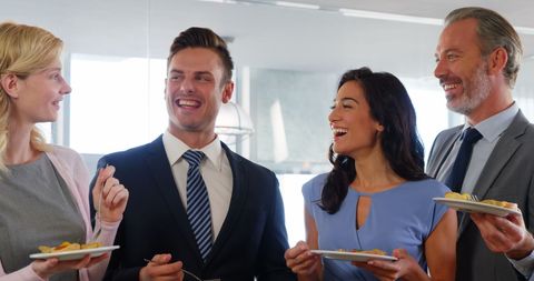 Business Professionals Enjoying Meal Together During Break
