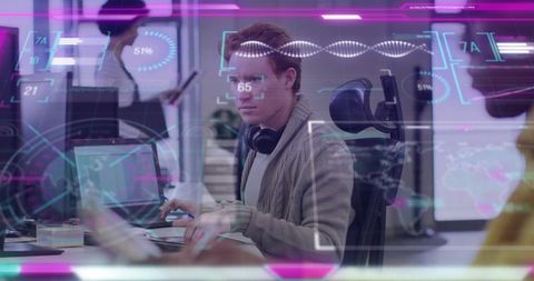 Young Businessman Analyzing Data with Futuristic Interface