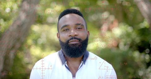 Contemplative bearded man with math formulas overlay in park with soft bokeh background