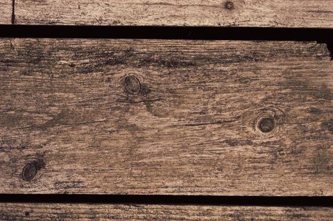Weathered wooden planks with natural knots close-up