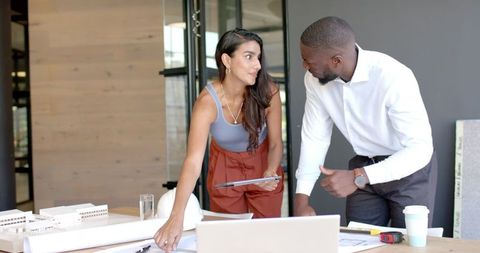 Diverse Team Collaborating on Modern Architectural Project