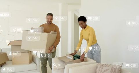 Couple unpacking boxes in modern minimalist living room with social media icons overlay
