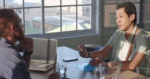 Business professionals strategizing in modern office setting