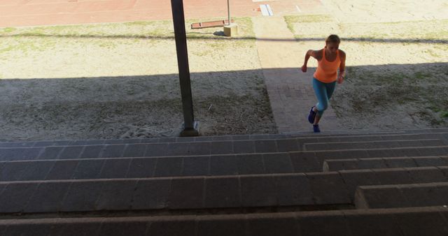 Woman Running Up Stadium Steps for Exercise - Download Free Stock Images Pikwizard.com