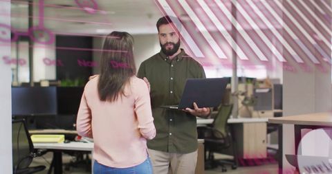 Team collaboration in modern office with coding overlay