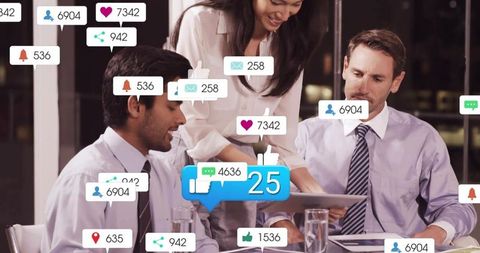 Business team reviewing social media metrics on tablet with notification icons