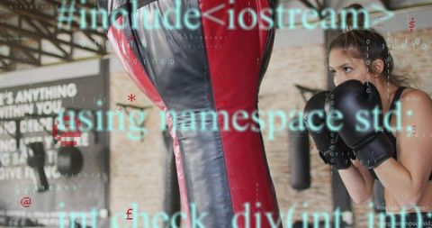Female boxer training guarding red-black punching bag, code overlay, focused determination
