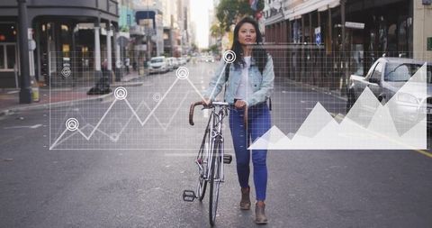 Asian woman pushing road bicycle through downtown street surrounded by data overlay