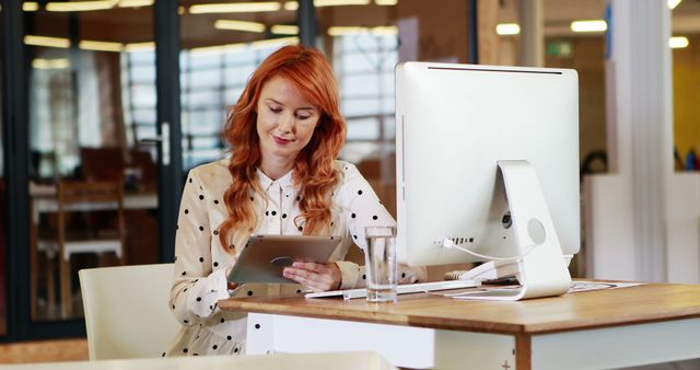 Young Woman Working on Tablet in Modern Office - Download Free Stock Images Pikwizard.com