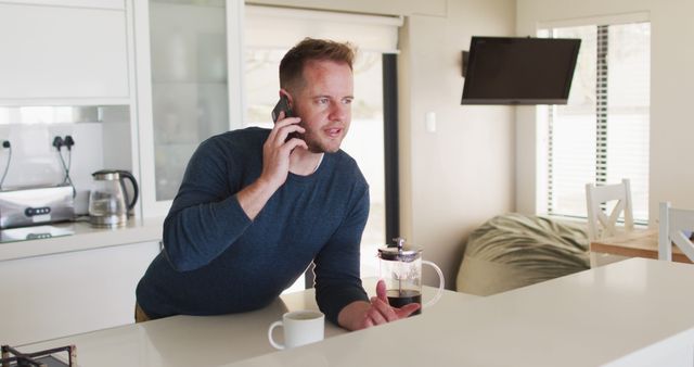 Man Talking on Phone While Making Coffee in Kitchen - Download Free Stock Images Pikwizard.com