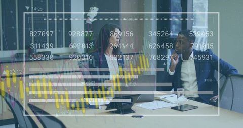 Business professionals analyzing candlestick charts and market data during meeting